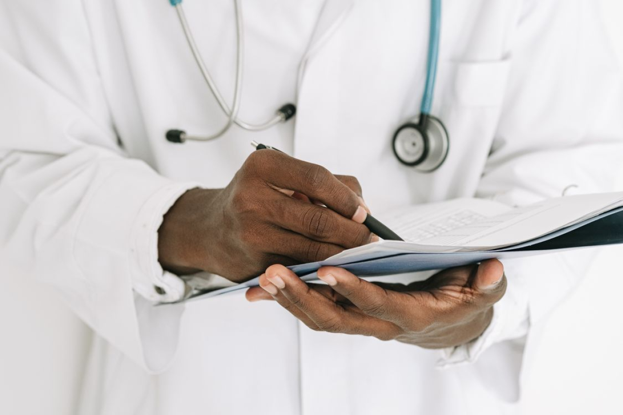 doctor writing notes.